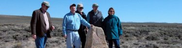 Federal trail staff pose of an Old Oregon Trail marker at South Pass, Wyoming.  NPS photo.